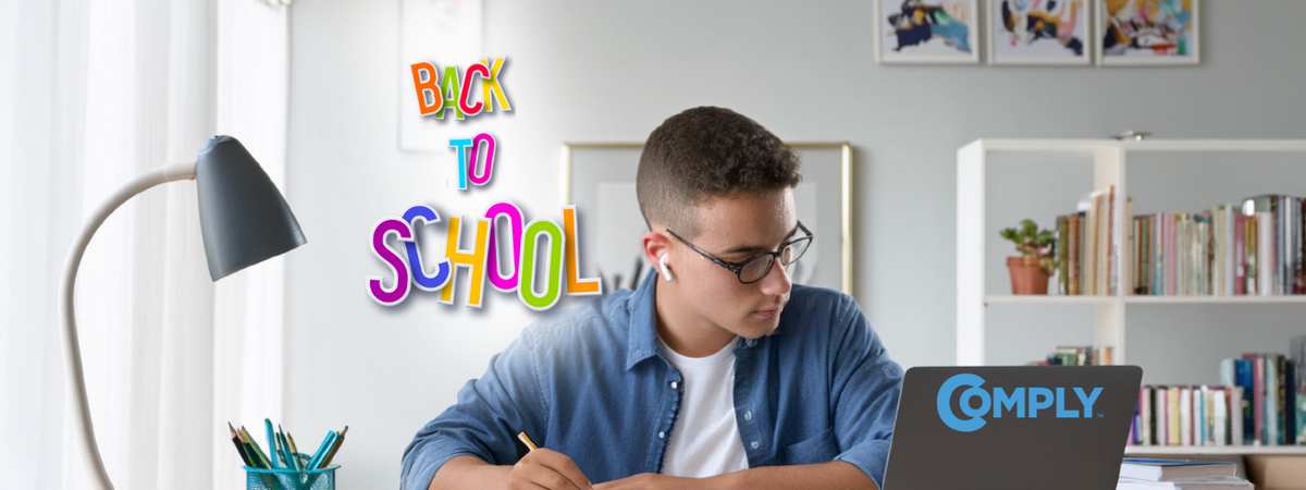 a student sitting at his desk studying intensely, with white true wireless earbuds in their ears not falling out as he gets ready to go back to school li